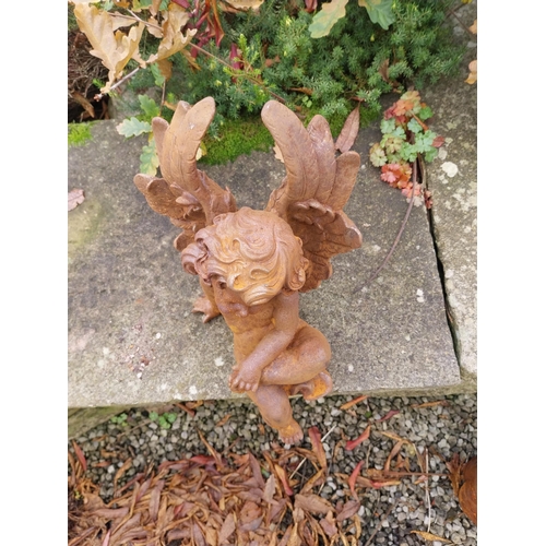 379 - Cast iron Cherub {40 cm H x 21 cm W x 25 cm D}.