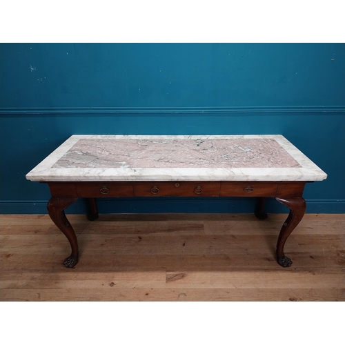 473 - 19th C. Irish mahogany side table raised on claw feet with three drawers in frieze with marble top. ... 