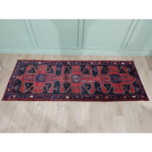 70 - Decorative Persian carpet runner. {304 cm H x 111 cm W}.