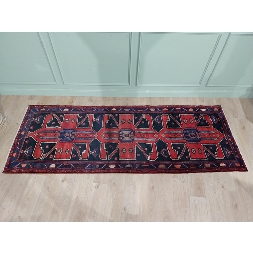 70 - Decorative Persian carpet runner. {304 cm H x 111 cm W}.