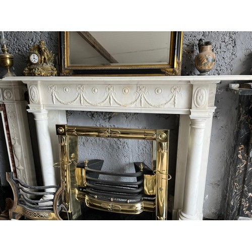 162 - Georgian carved Carrera marble fireplace with carved apron decorated with swags and ribbons and flan... 