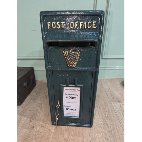 289 - Irish cast iron and metal post box {57 cm H x 24 cm W x 37 cm D}.