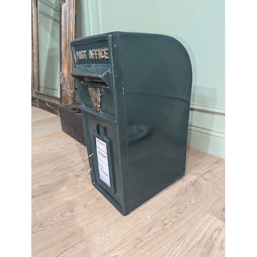 289 - Irish cast iron and metal post box {57 cm H x 24 cm W x 37 cm D}.