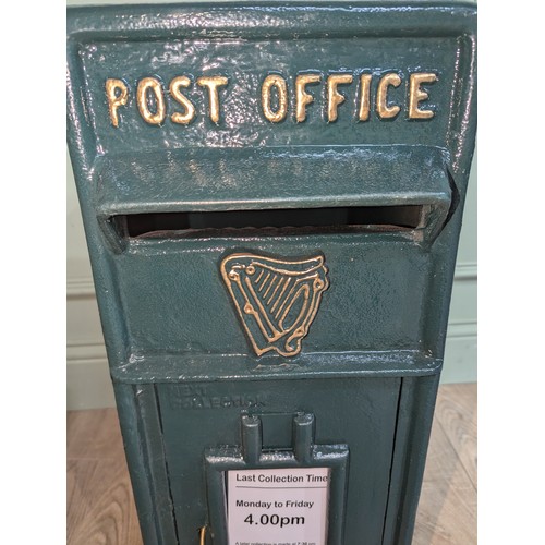 289 - Irish cast iron and metal post box {57 cm H x 24 cm W x 37 cm D}.