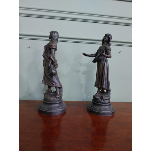 576 - Pair of 19th C. spelter figures {36 cm H x 13 cm Dia.}.