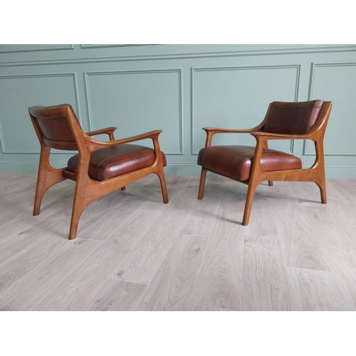 199 - Pair of cherrywood and hand dyed leather open arm chairs {74 cm H x 58 cm W x 82 cm D}.