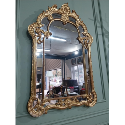 105 - Early 20th C. Italian giltwood wall mirror. {117 cm H x 76 cm W}.