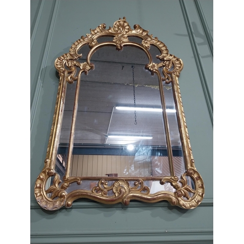 105 - Early 20th C. Italian giltwood wall mirror. {117 cm H x 76 cm W}.