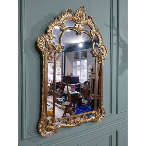 105 - Early 20th C. Italian giltwood wall mirror. {117 cm H x 76 cm W}.