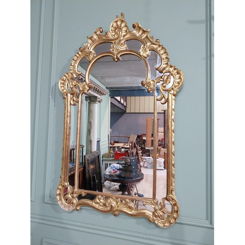 105 - Early 20th C. Italian giltwood wall mirror. {117 cm H x 76 cm W}.