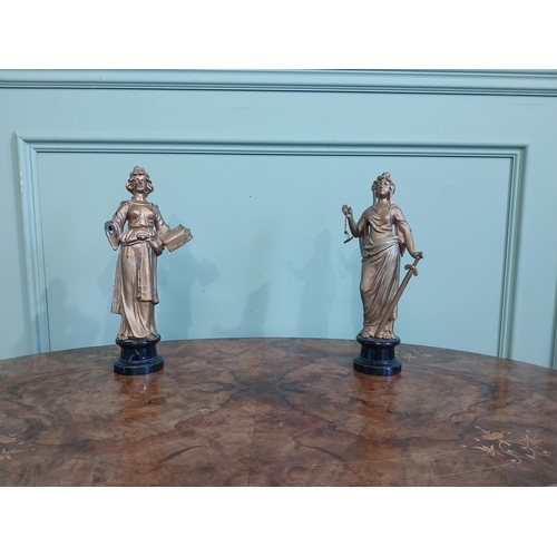 122 - Two early 20th C. gilded spelter figures of Justice. {32 cm H}