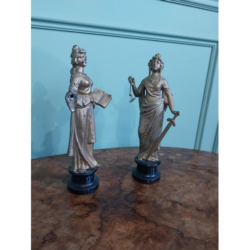 122 - Two early 20th C. gilded spelter figures of Justice. {32 cm H}