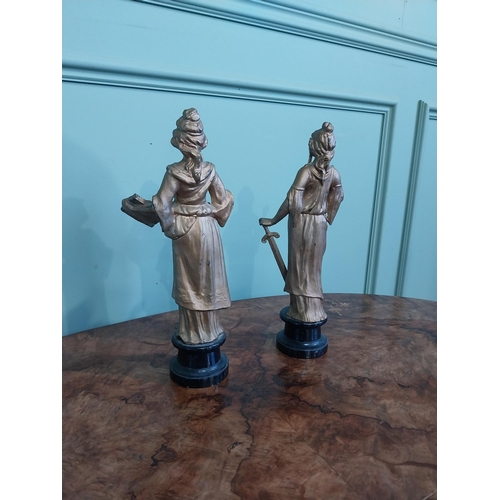 122 - Two early 20th C. gilded spelter figures of Justice. {32 cm H}