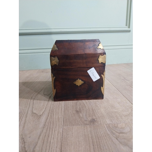 125 - Mahogany and brass bound box with fitted interior. {18 cm H x 15 cm W x 15 cm D}.