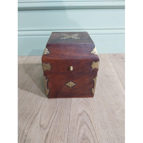 125 - Mahogany and brass bound box with fitted interior. {18 cm H x 15 cm W x 15 cm D}.