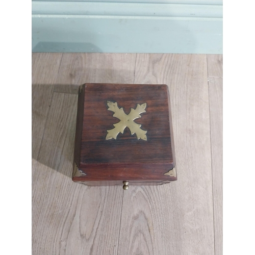 125 - Mahogany and brass bound box with fitted interior. {18 cm H x 15 cm W x 15 cm D}.