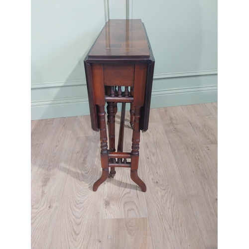 126 - Edwardian walnut Sunderland table on turned supports turned stretcher and shaped feet. {63 cm H x 59... 