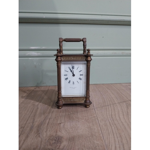 128 - Victorian brass carriage clock by Mackay Dundee {14 cm H x 8 cm W x 7 cm D}.