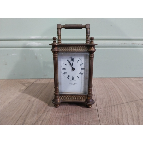 128 - Victorian brass carriage clock by Mackay Dundee {14 cm H x 8 cm W x 7 cm D}.