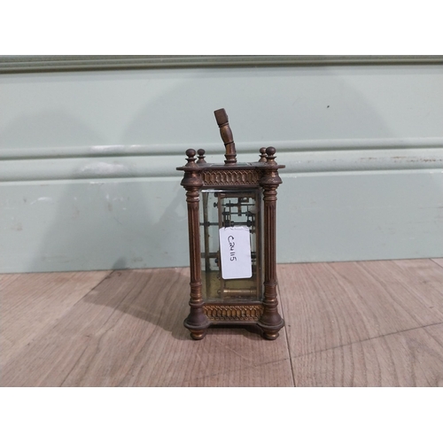 128 - Victorian brass carriage clock by Mackay Dundee {14 cm H x 8 cm W x 7 cm D}.