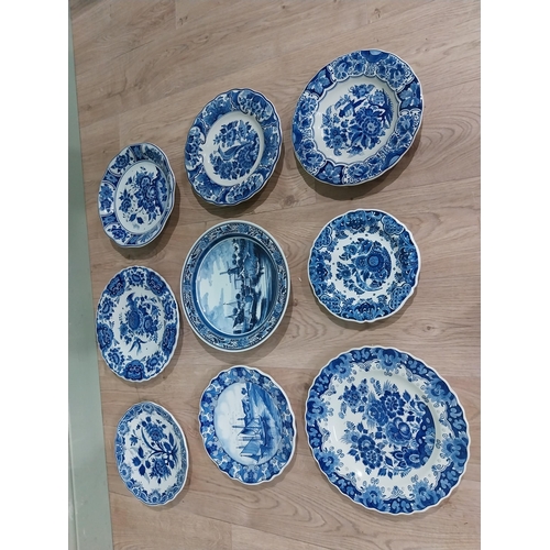 130 - Nine 19th C. Blue and white Dutch ceramic plates with boating and floral scenes. {Largest 30 cm Dia.... 