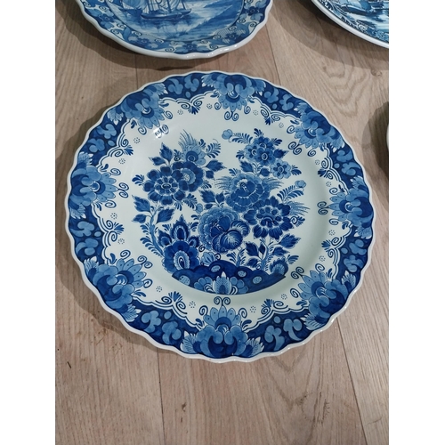 130 - Nine 19th C. Blue and white Dutch ceramic plates with boating and floral scenes. {Largest 30 cm Dia.... 