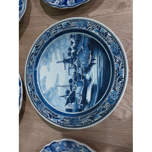 130 - Nine 19th C. Blue and white Dutch ceramic plates with boating and floral scenes. {Largest 30 cm Dia.... 