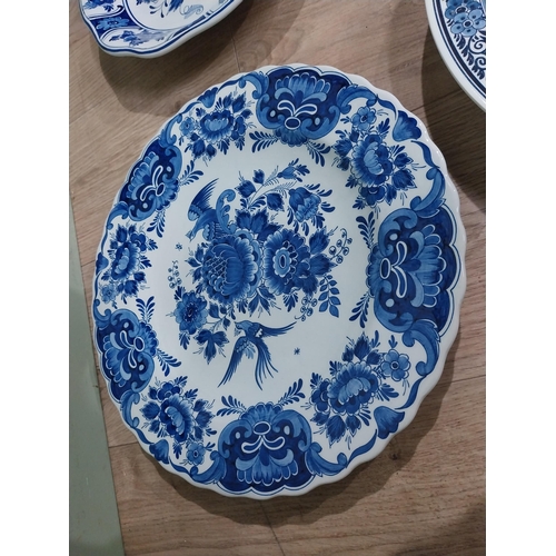 130 - Nine 19th C. Blue and white Dutch ceramic plates with boating and floral scenes. {Largest 30 cm Dia.... 