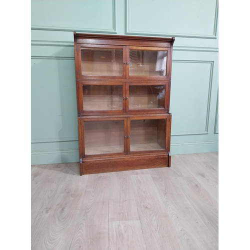 131 - 1940�s oak waterfall Globe Wernicke style glazed cabinet. {122 cm H x 88 cm W x 32 cm D}.