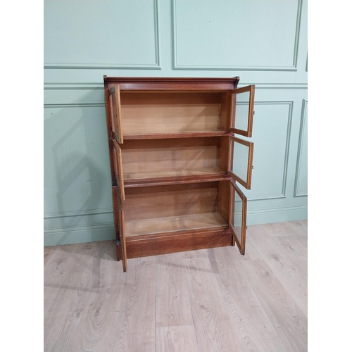 131 - 1940�s oak waterfall Globe Wernicke style glazed cabinet. {122 cm H x 88 cm W x 32 cm D}.