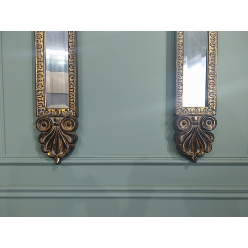 137 - Pair of gilt pier mirrors in the William IV style. {53 cm H x 15 cm W}.