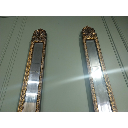 137 - Pair of gilt pier mirrors in the William IV style. {53 cm H x 15 cm W}.