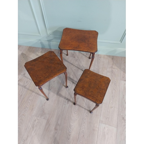 141 - Edwardian burr walnut nest of three tables raised on cabriole legs. {48 cm H x 40 cm W x 33 cm D}.