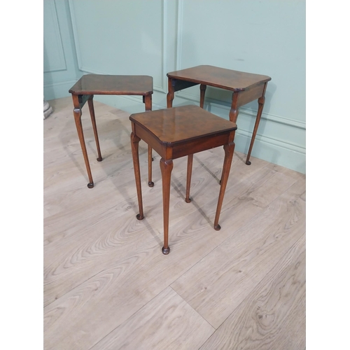 141 - Edwardian burr walnut nest of three tables raised on cabriole legs. {48 cm H x 40 cm W x 33 cm D}.