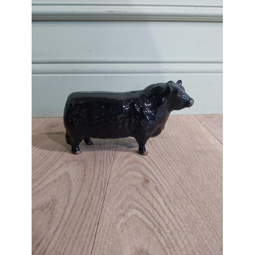 142 - Beswick ceramic model of Bull {11 cm H x 19 cm W x 5 cm D}.