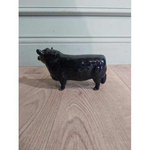 142 - Beswick ceramic model of Bull {11 cm H x 19 cm W x 5 cm D}.