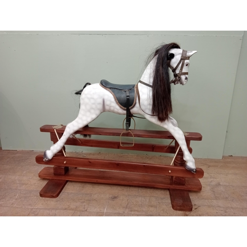 143 - Painted dapple grey rocking horse with leather reins and saddle.  {H 115cm x W 130cm x D 46cm}. NOT ... 