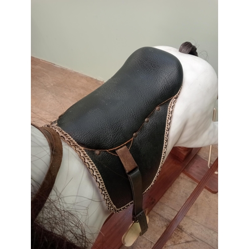 143 - Painted dapple grey rocking horse with leather reins and saddle.  {H 115cm x W 130cm x D 46cm}. NOT ... 