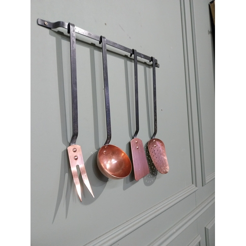 144 - Good quality set of early 20th C. Copper and wrought iron kitchen utensils on bracket. {46 cm H x 49... 