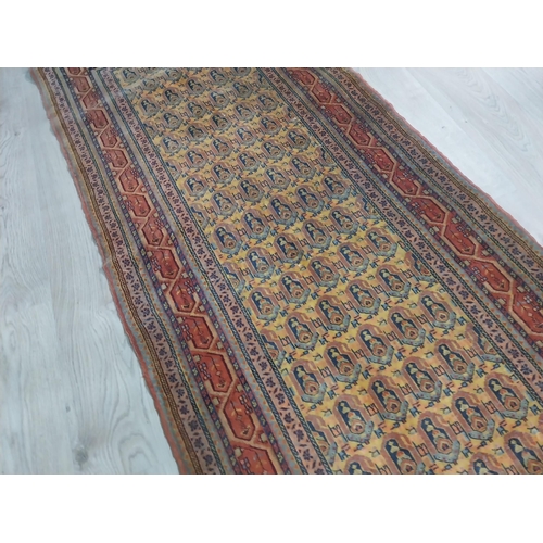 145 - Antique Usak decorative carpet runner. {383 cm L x 90 cm W}.