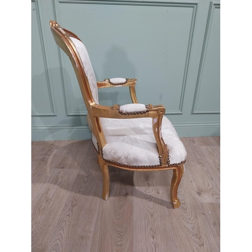 150A - French giltwood upholstered open armchair in the Victorian style. {90 cm H x 61 cm W x 64 cm D}.