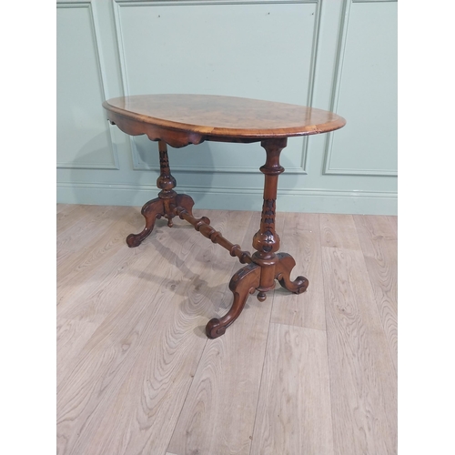 158 - Victorian burr walnut centre table with single turned stretcher flanked by two carved columns. {67 c... 