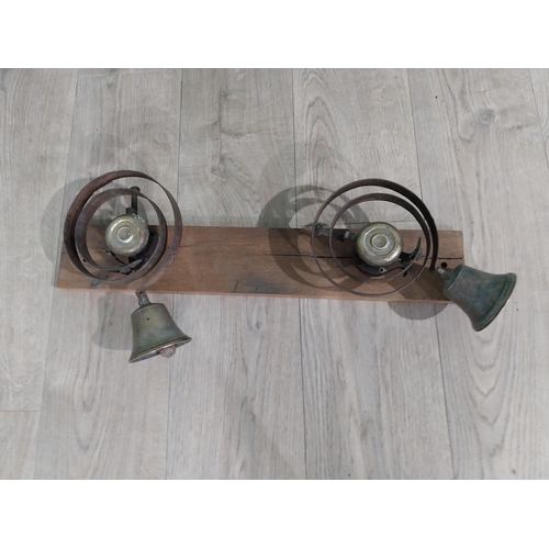 170 - Two 19th C. House bells mounted on oak plaque. {25 cm H x 60 cm W x 14 cm D}.