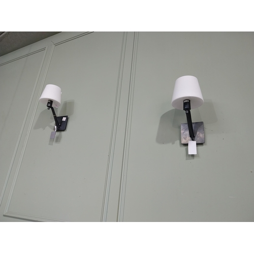 172 - Pair of bronze wall lights with opaline glass shades. {33 cm H x 18 cm W x 26 cm D}.