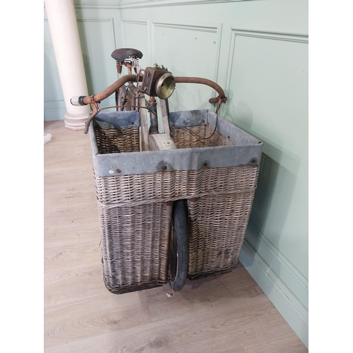 175 - Early 20th C. Messenger bicycle with wicker basket. {97 cm H x 170 cm W x 66 cm D}.