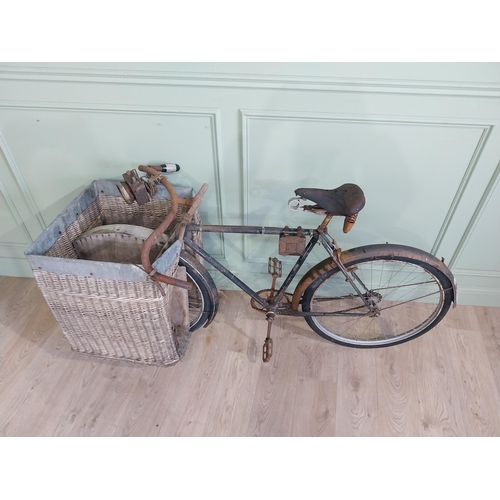 175 - Early 20th C. Messenger bicycle with wicker basket. {97 cm H x 170 cm W x 66 cm D}.