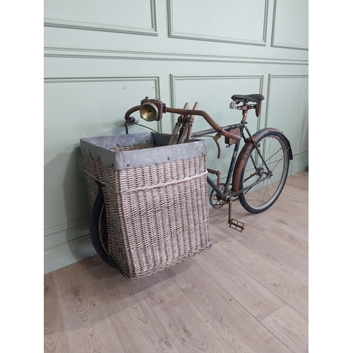 175 - Early 20th C. Messenger bicycle with wicker basket. {97 cm H x 170 cm W x 66 cm D}.