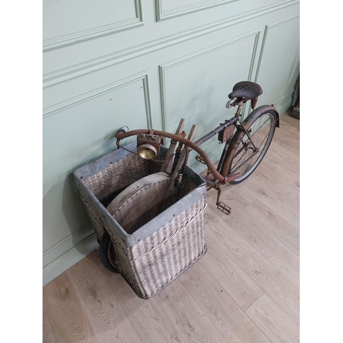 175 - Early 20th C. Messenger bicycle with wicker basket. {97 cm H x 170 cm W x 66 cm D}.