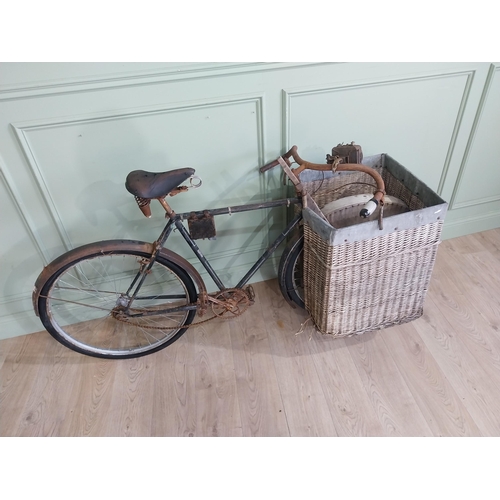 175 - Early 20th C. Messenger bicycle with wicker basket. {97 cm H x 170 cm W x 66 cm D}.