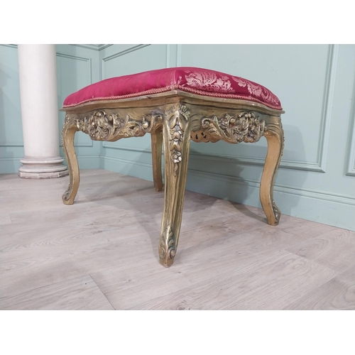 204 - French gilt wood and upholstered foot stool on cabriole legs. {54 cm H x 95 cm W x 66 cm D}.